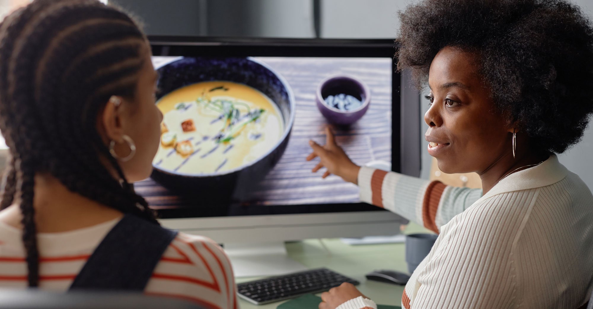 black-woman-discussing-pictures-photos-with-friend-2025-03-06-03-23-03-utc